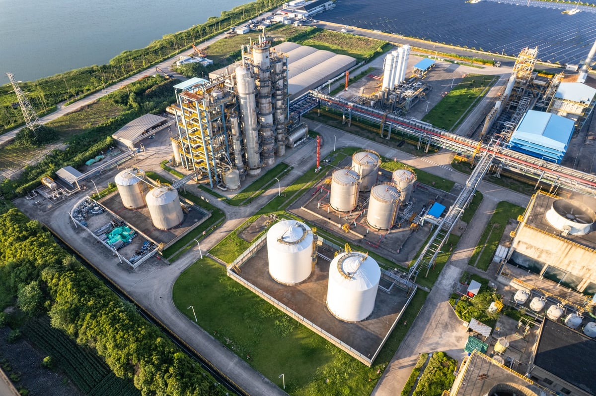 Aerial view of a coastal oil refinery and tank farm